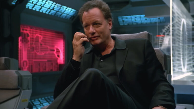 Frank Simmons (John de Lancie) in command